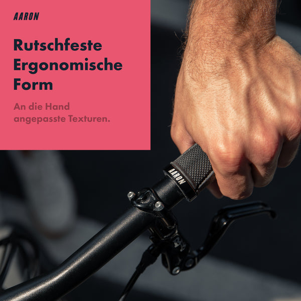 AARON MTB Fahrradgriffe - Schwarz mit rutschfester, ergonomischer Form und handangepassten Texturen am Fahrradlenker.