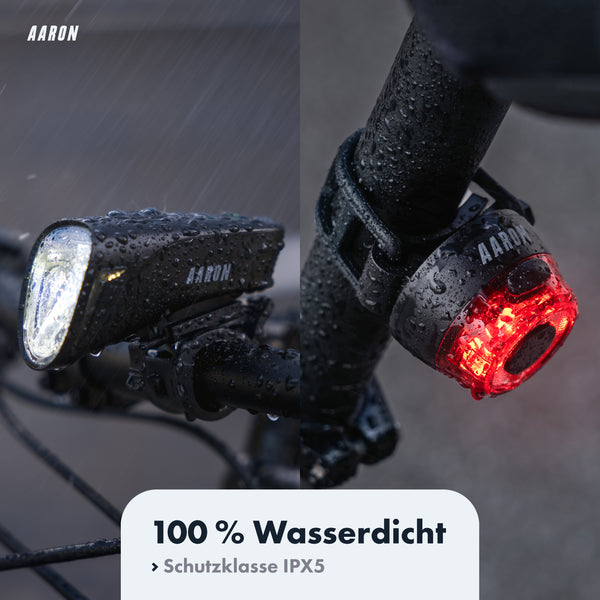 AARON LUX Pro Fahrradlicht Set - StVZO zugelassen, wasserdicht IPX5, Front- und Rücklicht bei Regen montiert am Fahrrad.
